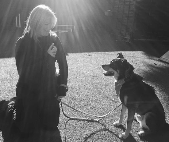 Laura training dog with ball